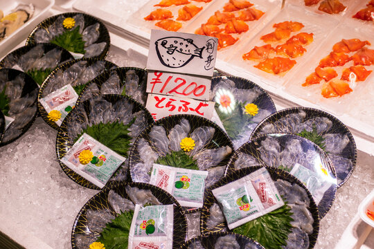 Japanese Fugu Puffer fish sashimi on sale at Osaka Kizu Wholesale Market. Only chefs who pass a strict prefectural exam in Japan are qualified to prepare Pufferfish sashimi due to its toxin.