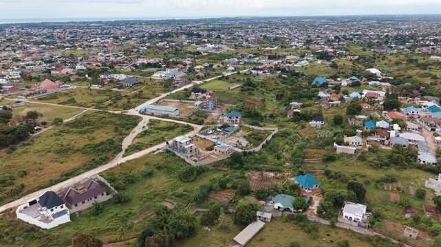 Dar Es Salaam Tanzania - 26 June 2026 - Aerial view of Kigamboni Dar es Salaam showcasing residential settlements houses green landscapes and expanding urban development in Tanzania