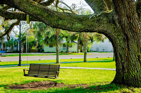Wooden swing at Depot Park in Bay Saint Louis Mississippi