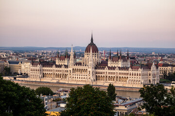 Fototapeta premium Parliament building in Budapest next to the Danube River at sunset. Budapest, capital of Hungary. 