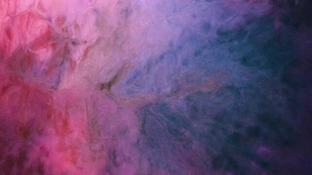 Alcohol ink is used to create abstract video art in vibrant colors during a creative session