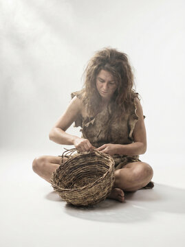 Primitive Woman Weaving Handmade Basket