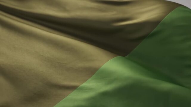 Elegant Fabric Motion: Close-up of waving green and olive silk cloth with soft ripples, ideal for luxury backgrounds and fashion presentations.