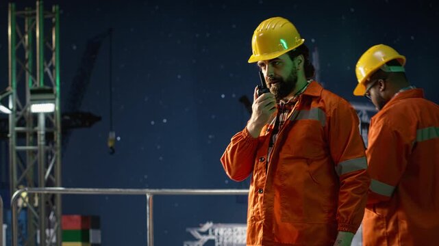 Offshore platform engineer provides operational updates over secure walkie talkie network during oil crisis with offshore platform context.