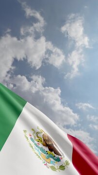 Vertical Shot of a Mexican Flag Waving In Wind with Copy Space
