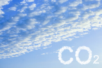 Obraz premium Blue sky with CO2 inscription and fluffy clouds