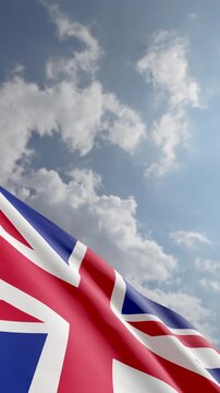 Vertical Shot of a United Kingdom Flag Waving In Wind with Copy Space