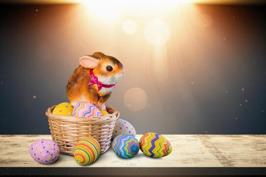 Bunny Easter with a basket of colorful easter eggs, AI generated image