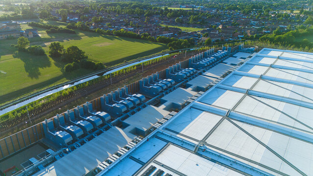 Aerial view of the Google Data Centre - Waltham Cross with industrial cooling units and surrounding green fields in Cheshunt, England, United Kingdom.