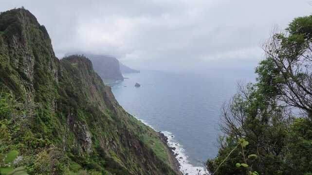 Static shot of dramatic ocean cliffs along Vereda do Larano trail in Madeira