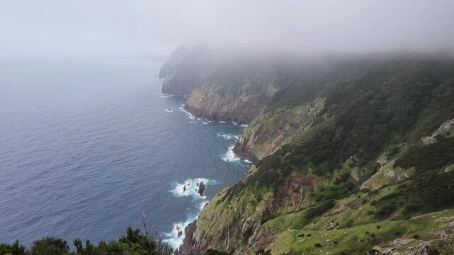 Static shot of dramatic ocean cliffs along Vereda do Larano trail in Madeira