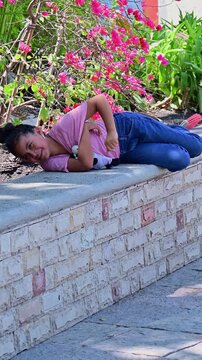 Latina girl throwing a tantrum in the park.