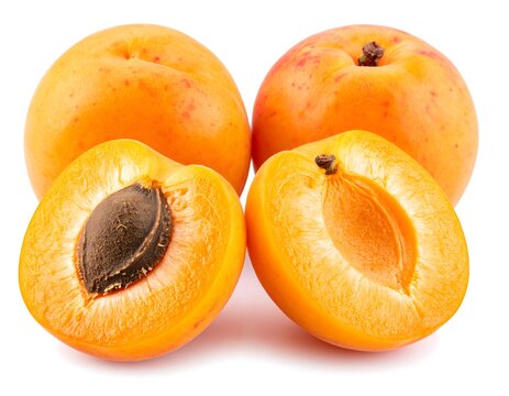 Fresh whole apricots with pits on white background, white background