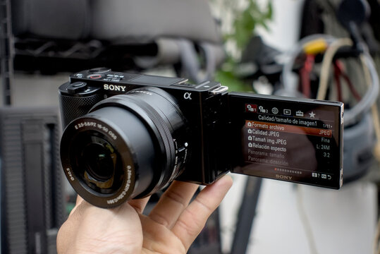 Zapopan Jalisco, Mexico - June 3 , 2026: Sony ZV-E10 mirrorless camera with 16-50mm lens held by a hand close up