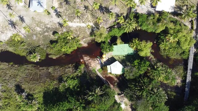 Vista a&eacute;re entre o Rio Imbassa&iacute; e a praia, no litoral norte da Bahia, proximo a Salvador, Brasil