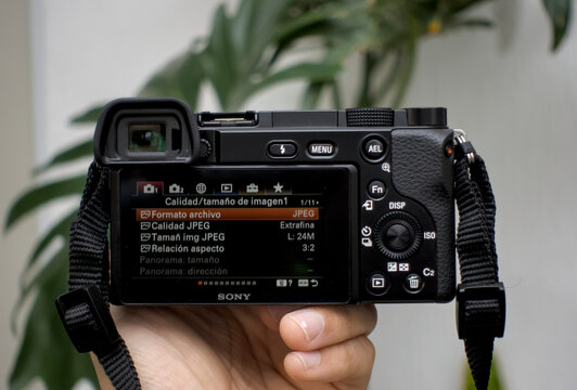 Zapopan Jalisco, Mexico, June 3, 2026: Title: Sony a6100 Camera with Yongnuo 35mm f1.8 Lens Close Up for Hardware Review