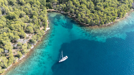 Sailboat anchoring in paklina cove, hvar island, croatia © Travel To Exist
