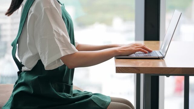 Restaurant staff entering data on a laptop
