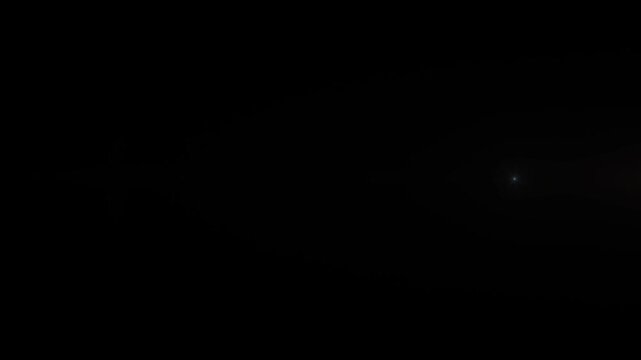 Fasting glow gold orange star sun lights optical lens flares shiny animation art on black abstract background for screen project overlay.  Lighting lamp rays effect dynamic bright video