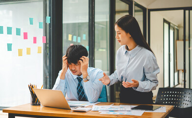 Fototapeta premium Businessmen are arguing after encountering problems in business and making mistakes at work, tense work atmosphere..