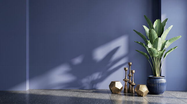 Blue wall interior with plant, gold decor, and shadow play potted plant golden decor