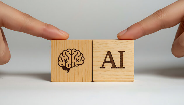 Human fingers touch wooden blocks with brain icon and AI text during concept development