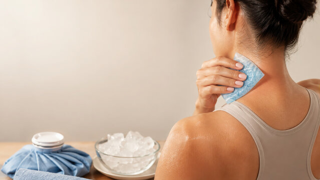 Cooling relief from heat and stress is essential for recovery and relaxation. person applies cold pack to neck for soothing comfort