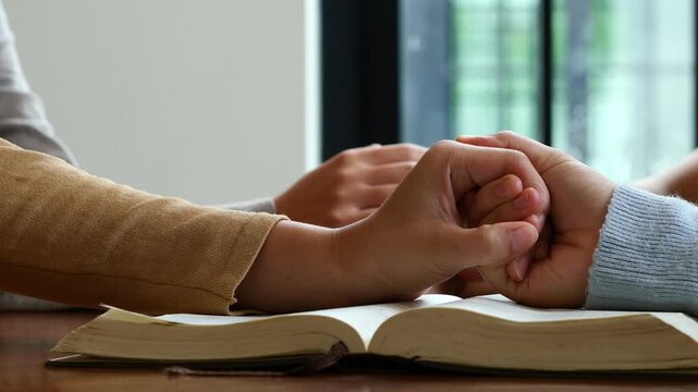 Group of people praying. Christian worship and pray. Christian group of people holding hands praying worships together to believe
