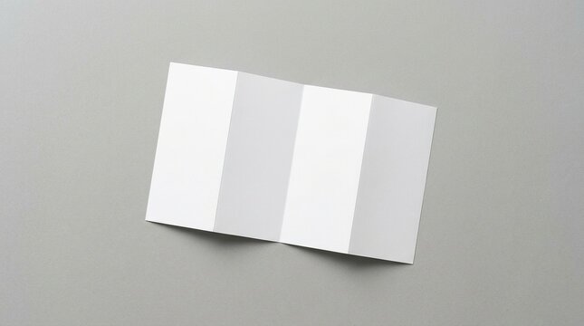 Minimalist design of a blank tri fold brochure on a soft gray background ideal for customization presentations or marketing materials with clean lines and smooth texture