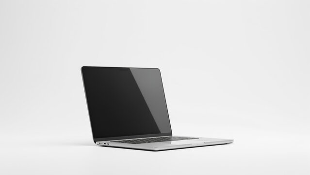 Laptop computer with a blank dark screen sits angled on a white surface to provide a professional mockup for digital content.