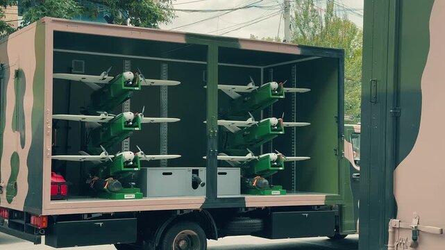 Armenian military drones stored inside a transport truck during a public exhibition in Yerevan, showcasing modern unmanned aerial vehicle technology, tactical combat surveillance equipment