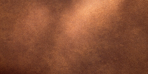Brown suede leather background texture with soft light effect © Hendri