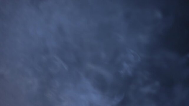 Full frame real time white smoke texture drifting fast on isolated dark background cinematic overlay b roll