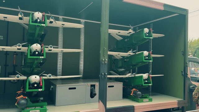 Armenian military drones stored inside a transport truck during a public exhibition in Yerevan, showcasing modern unmanned aerial vehicle technology, tactical combat surveillance equipment