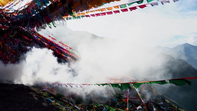 Colorful Prayer Flags Above Misty Mountain Pass
