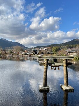Stone Torii Gate in Water at Kinrin Lake, Yufuin, Japan