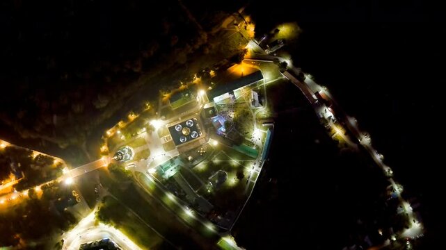 Ryazan, Russia. The Ryazan Kremlin and Cathedral of the Assumption, aerial night view with illuminated domes and historic ensemble glowing above the Oka River valley. Drone footage, HEAD OVER SHOT wi