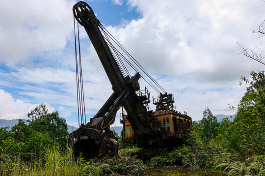 Abandoned industrial mining crane machinery in Panguna mine town in Bougainville, Papua New Guinea