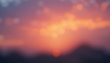 Fototapeta premium Blurred orange and purple sunset or sunrise with bokeh effect, over mountains or hills