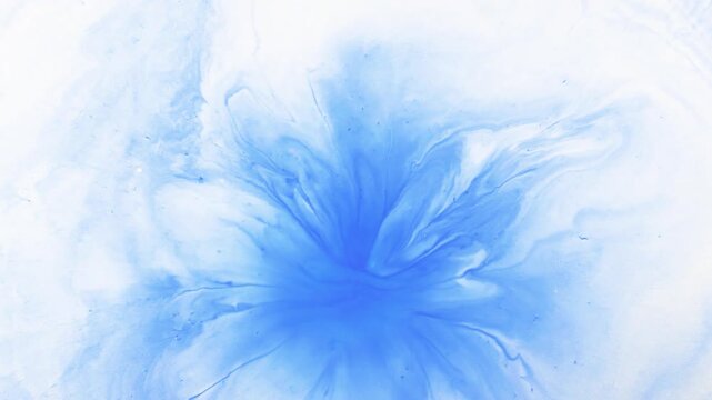 Abstract art in motion. This video captures the magical moment when dark blue ink slowly spreads, expands, and mixes organically on a clean white surface.