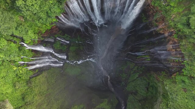 Amazing aerial view Tumpak Sewu waterfall in the morning on Java island, Indonesia.
