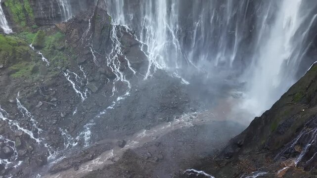 Amazing aerial view Tumpak Sewu waterfall in the morning on Java island, Indonesia.
