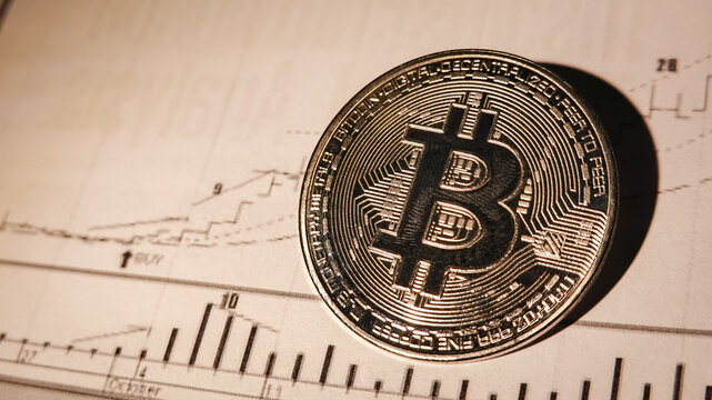 Silver cryptocurrency coins, Bitcoin, placed on a technical graph background. Investment concept, trading digital assets in the investment market for traders.