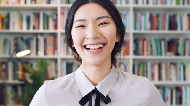 Confident, face and businesswoman with smile in library, knowledge or paralegal with job opportunity. Corporate, law assistant and Asian person with career growth, legal books and research for case