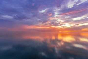 Fototapeta premium Panorama of evening sky with clouds. sunset Sky background, Sunrise sky with lighted clouds. Beauty evening sunrise over sea