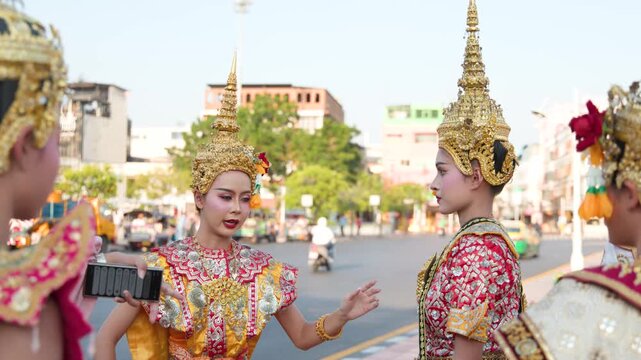 Traditional Thai Khon Dancers Performing in Front of Wat Suthat Temple