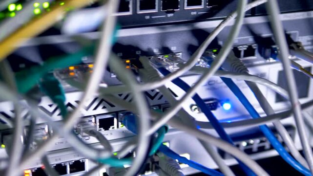 Close Up of Network Cables and Server Rack Lights in Data Center