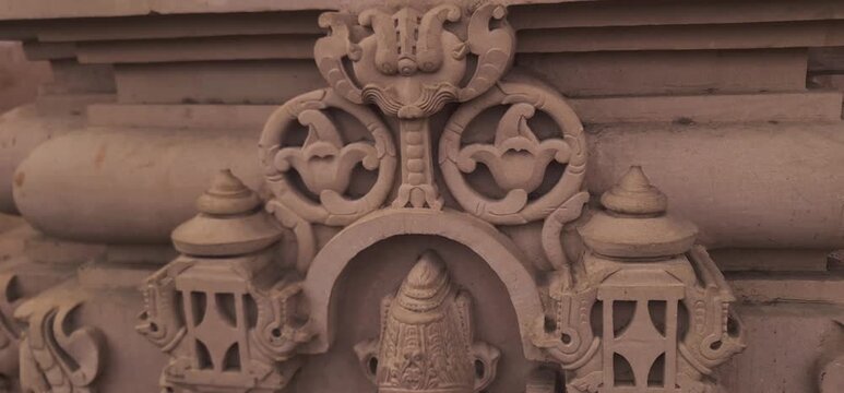 Intricate Traditional Indian Carvings and Religious Relief Designs on Sandstone wall at Heritage Corridor in Ujjain, Madhya Pradesh, India 