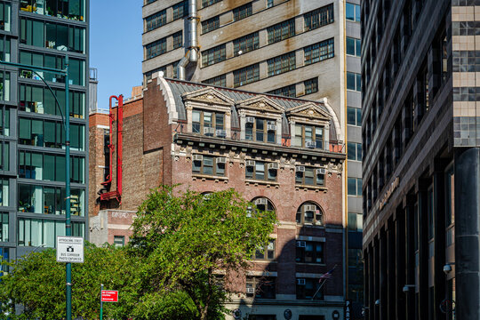 Historic Romanesque Revival Building Amid Modern Skyscrapers in Downtown Brooklyn