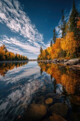 Fototapeta premium Canadian boreal forest in autumn with vibrant foliage and calm water